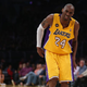 Kobe Bryant limps on the court on April 12, 2013. (Jeff Gross/Getty Images)